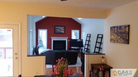 16 Parker Road Edison, NJ 08820 - Photo 10 of 25 a view of a livingroom with furniture and a fireplace