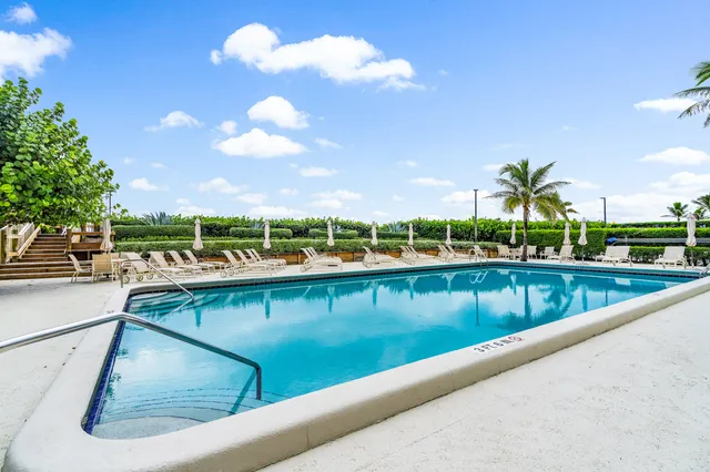 a view of swimming pool from a balcony