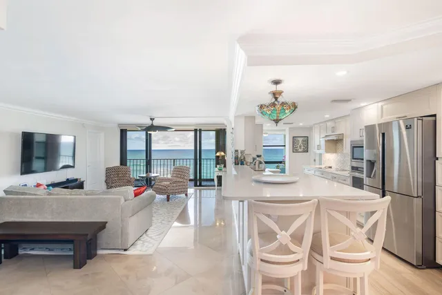 a living room with fireplace furniture and a flat screen tv