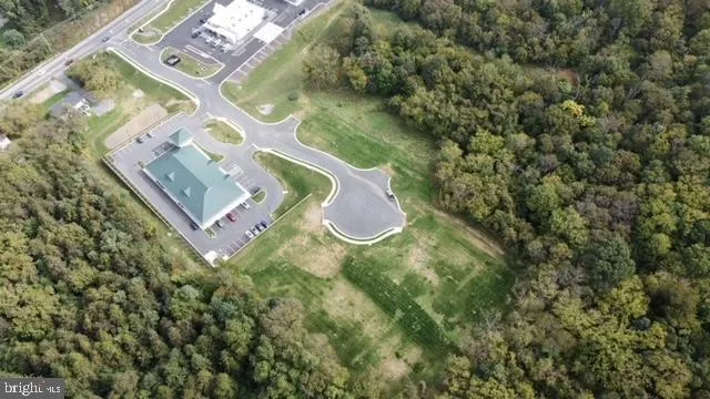 an aerial view of a residential houses with outdoor space