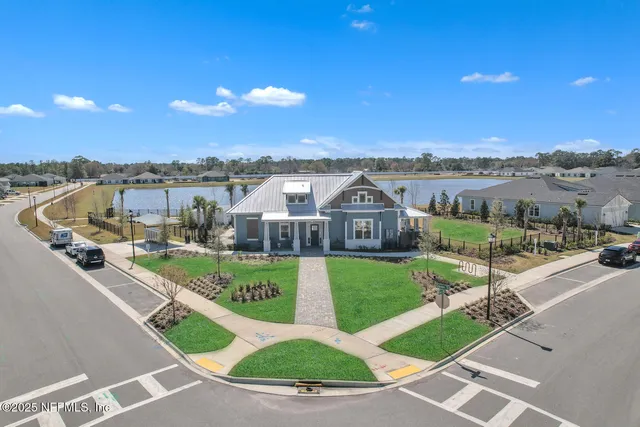 a view of a garden with a table and chairs