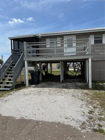 a view of a house with a door and wooden floor