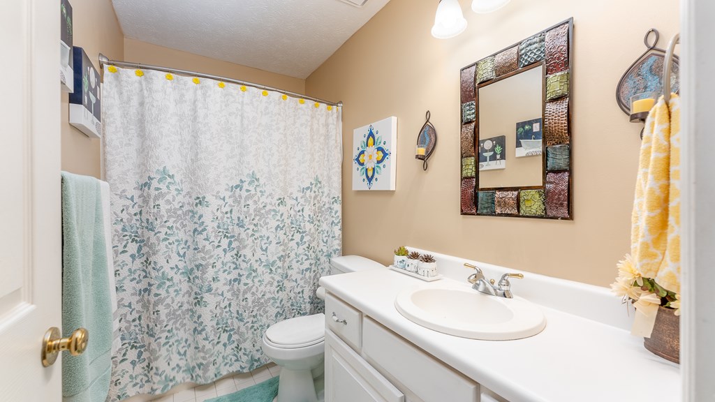 4420 Reese Road, Unit 1D Columbus, GA 31907 - Photo 13 of 17 a bathroom with a sink toilet and shower