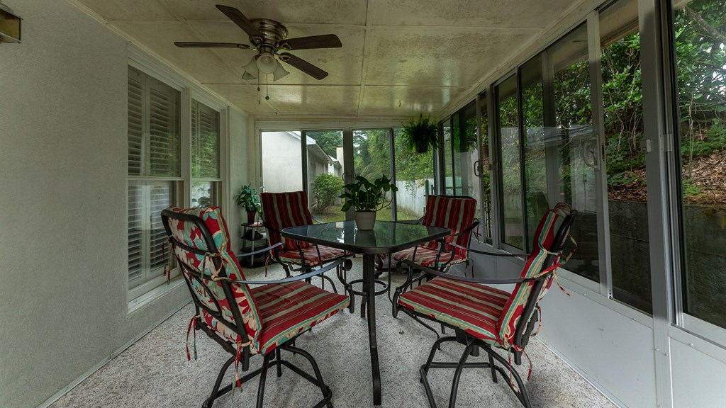 4420 Reese Road, Unit 1D Columbus, GA 31907 - Photo 14 of 17 a view of a patio with a table chairs and a backyard