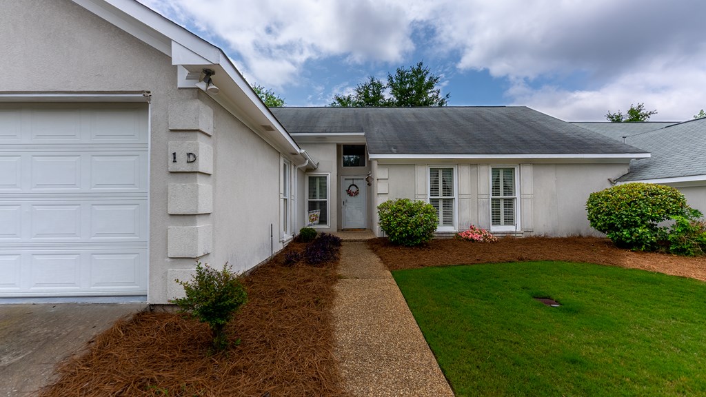 4420 Reese Road, Unit 1D Columbus, GA 31907 - Photo 2 of 17 a front view of a house with a yard