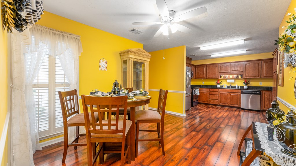 4420 Reese Road, Unit 1D Columbus, GA 31907 - Photo 3 of 17 a view of a dining room with furniture and a chandelier