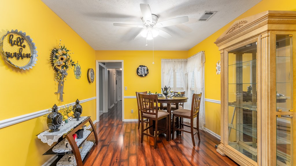 4420 Reese Road, Unit 1D Columbus, GA 31907 - Photo 5 of 17 a view of a dining room with furniture and wooden floor