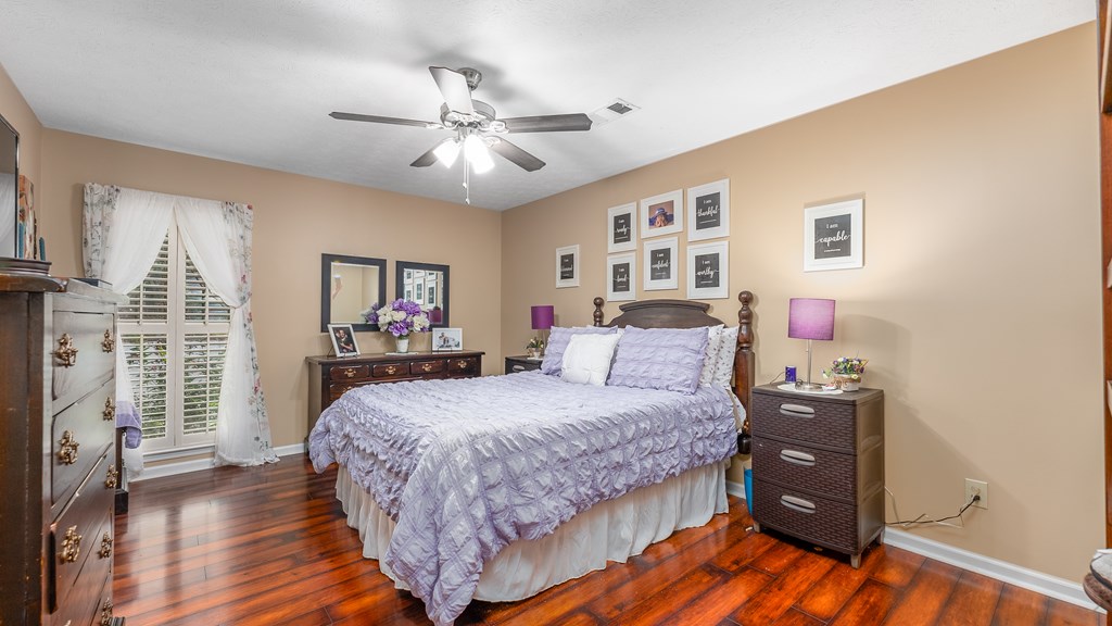 4420 Reese Road, Unit 1D Columbus, GA 31907 - Photo 9 of 17 a bedroom with a bed and wooden floor