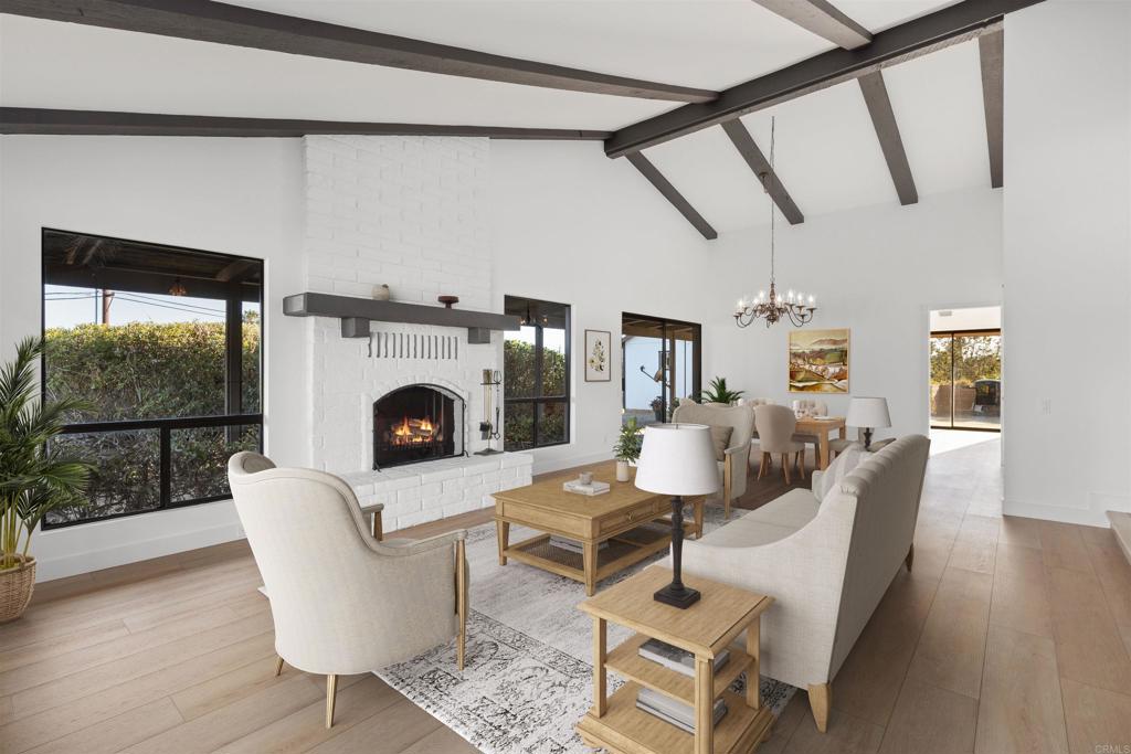112 Palmas Norte Fallbrook, CA 92028 - Photo 17 of 74 a living room with furniture a fireplace and a floor to ceiling window