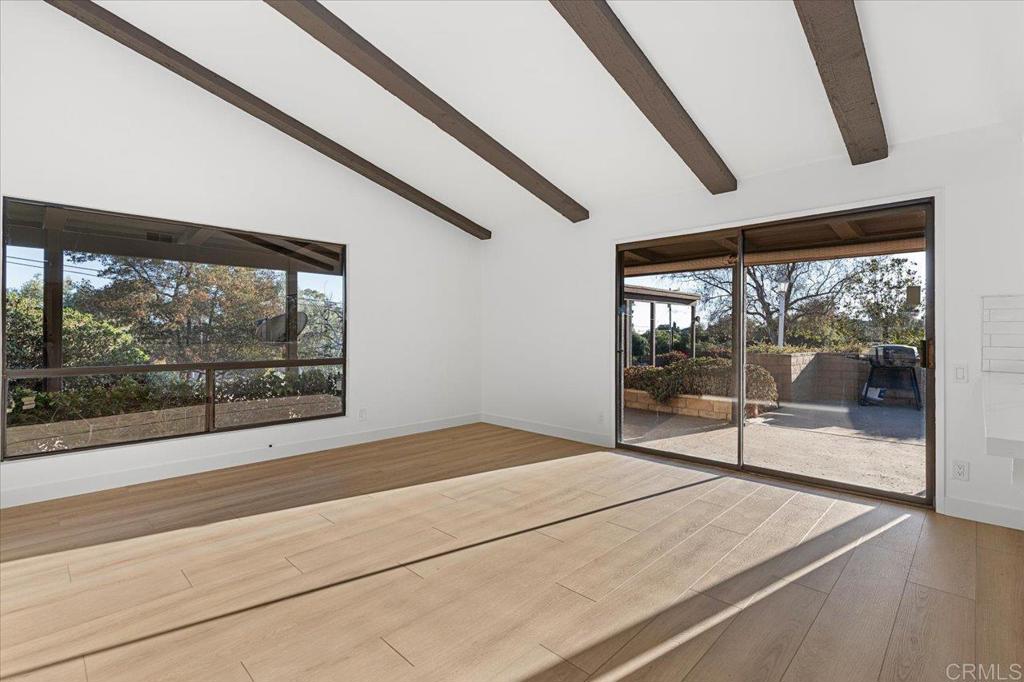 112 Palmas Norte Fallbrook, CA 92028 - Photo 24 of 74 a bedroom with a bed and large window with outer view