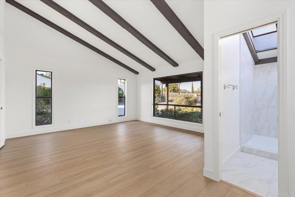 112 Palmas Norte Fallbrook, CA 92028 - Photo 31 of 74 a view of an empty room with wooden floor and a window