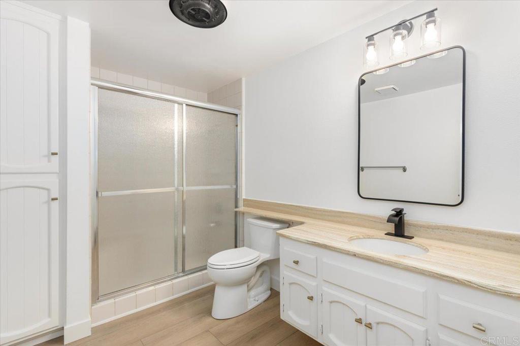 112 Palmas Norte Fallbrook, CA 92028 - Photo 39 of 74 a bathroom with a sink a toilet and a mirror