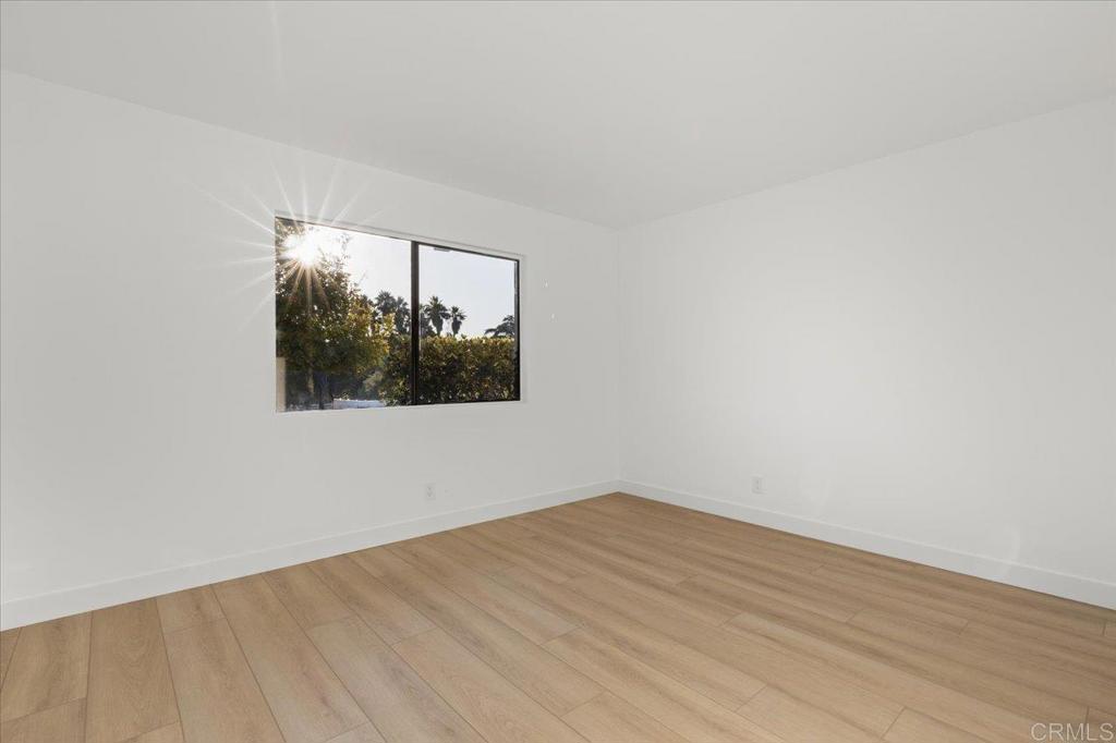 112 Palmas Norte Fallbrook, CA 92028 - Photo 40 of 74 a view of empty room with wooden floor and fan