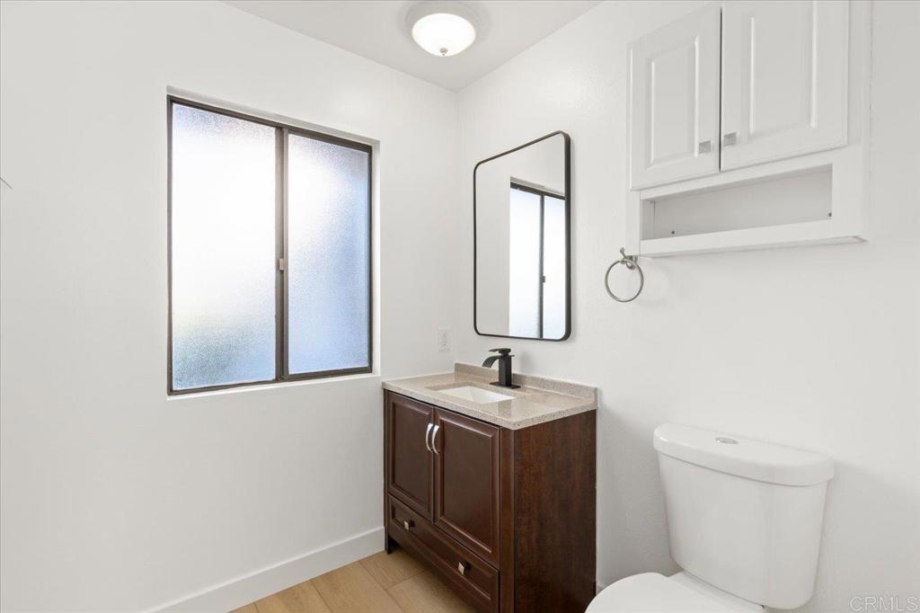 112 Palmas Norte Fallbrook, CA 92028 - Photo 42 of 74 a bathroom with a toilet sink and mirror