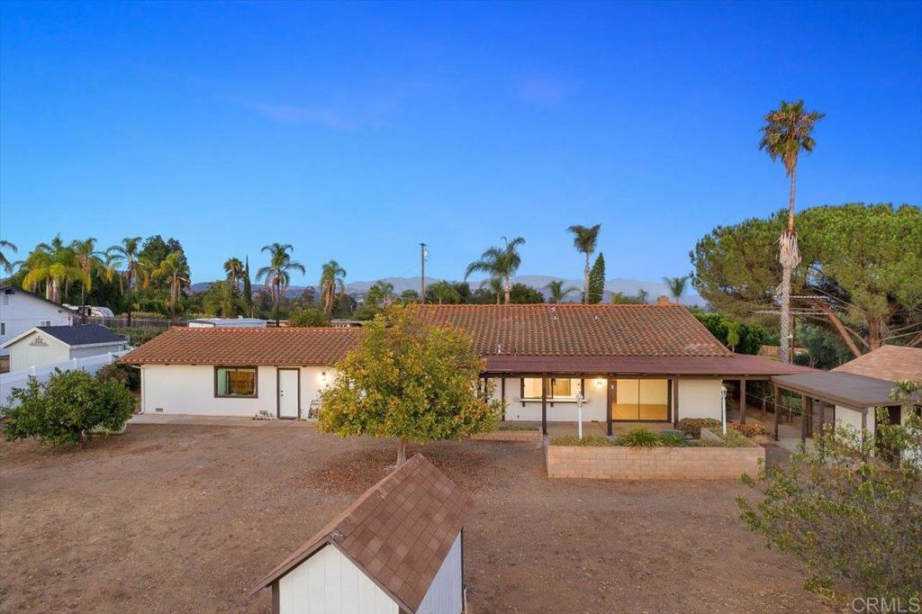 112 Palmas Norte Fallbrook, CA 92028 - Photo 45 of 74 a front view of a house with a yard and garage