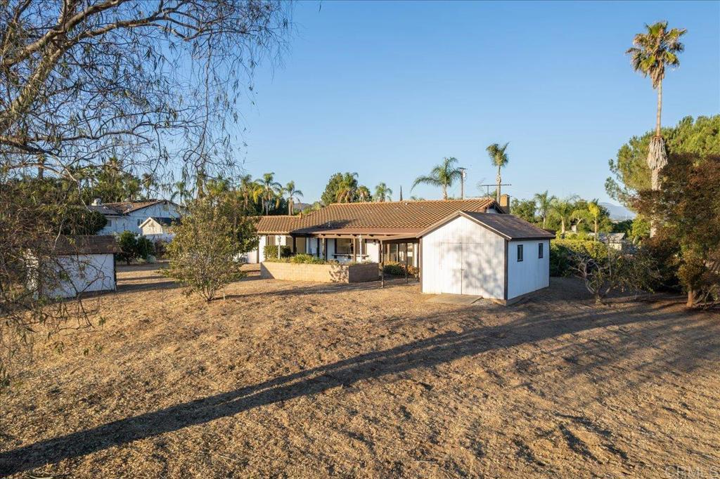 112 Palmas Norte Fallbrook, CA 92028 - Photo 59 of 74 a front view of a house with a yard and covered with snow