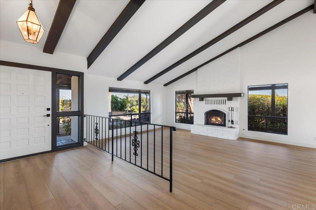 112 Palmas Norte Fallbrook, CA 92028 - Photo 10 of 74 a view of a livingroom with furniture fireplace and hardwood floor