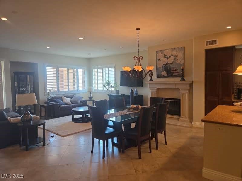 20 Via Mantova, Unit 202 Henderson, NV 89011 - Photo 13 of 60 Dining space with a chandelier, light tile patterned floors, and recessed lighting