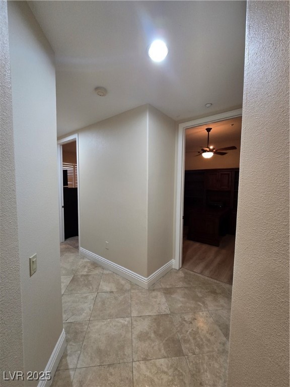 20 Via Mantova, Unit 202 Henderson, NV 89011 - Photo 27 of 60 Hall featuring baseboards and light tile patterned floors