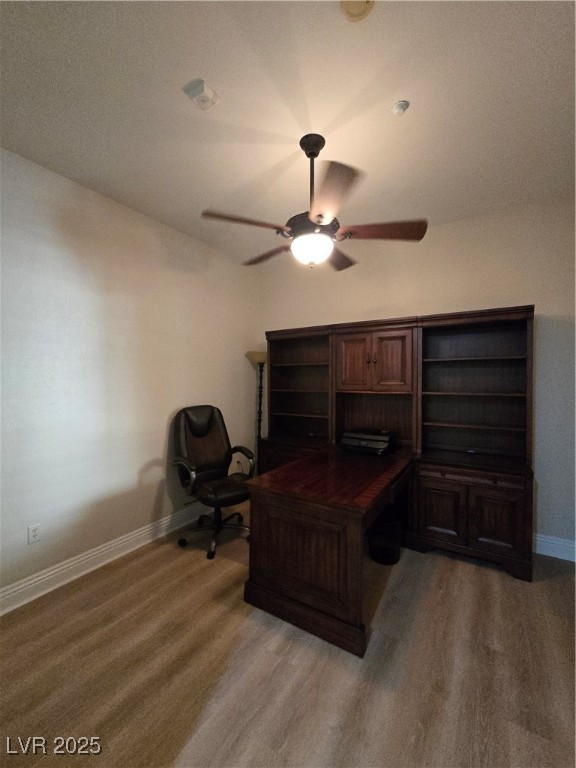 20 Via Mantova, Unit 202 Henderson, NV 89011 - Photo 28 of 60 Home office featuring ceiling fan and light wood finished floors