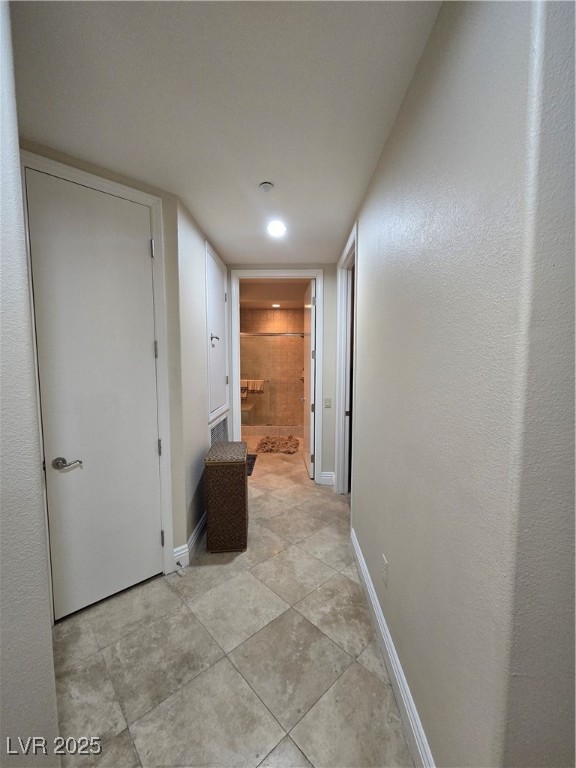 20 Via Mantova, Unit 202 Henderson, NV 89011 - Photo 30 of 60 Corridor with light tile patterned flooring and recessed lighting
