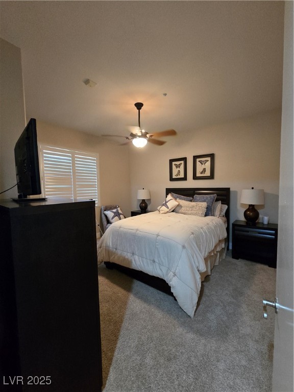 20 Via Mantova, Unit 202 Henderson, NV 89011 - Photo 32 of 60 Carpeted bedroom featuring ceiling fan