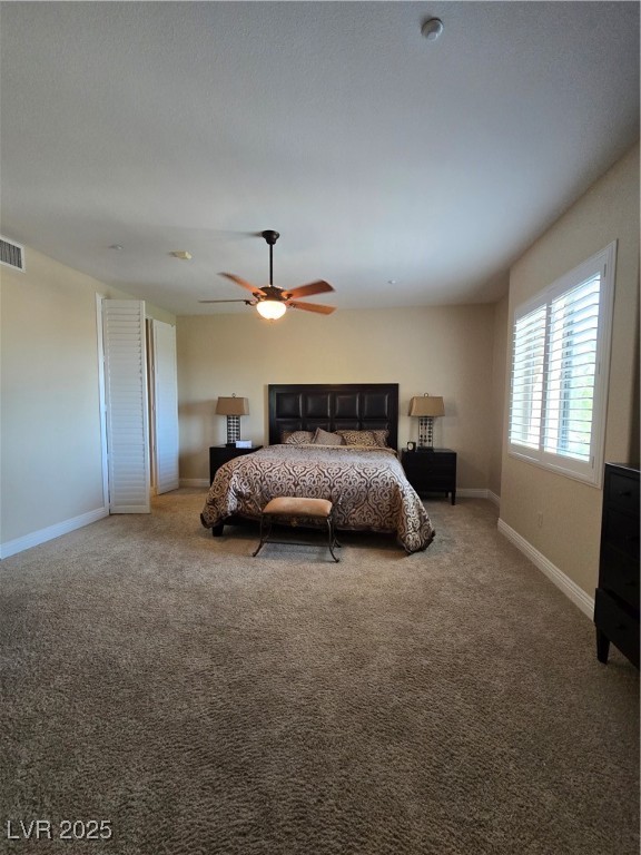 20 Via Mantova, Unit 202 Henderson, NV 89011 - Photo 39 of 60 Bedroom with carpet flooring and a ceiling fan