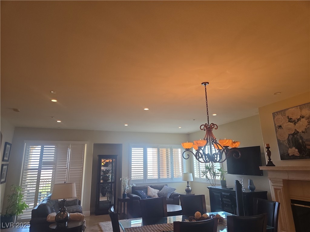 20 Via Mantova, Unit 202 Henderson, NV 89011 - Photo 6 of 60 Living room featuring a chandelier, a fireplace, and recessed lighting