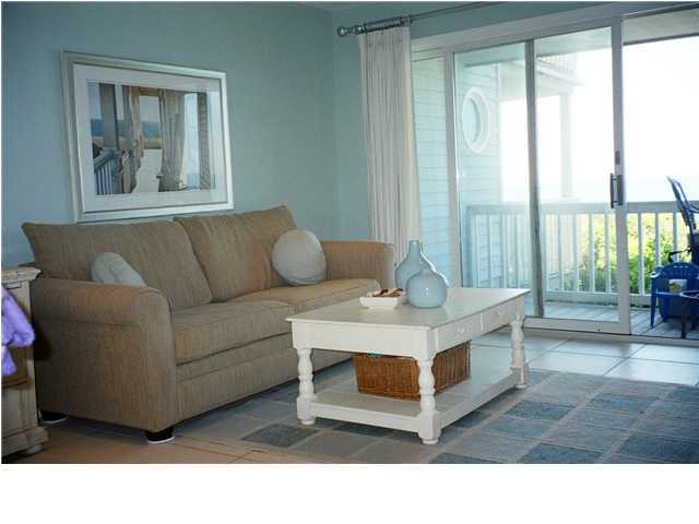 8294 Hwy Inlet Beach, Unit 7 30A Inlet Beach, FL 32461 - Photo 3 of 8 a living room with furniture and a floor to ceiling window
