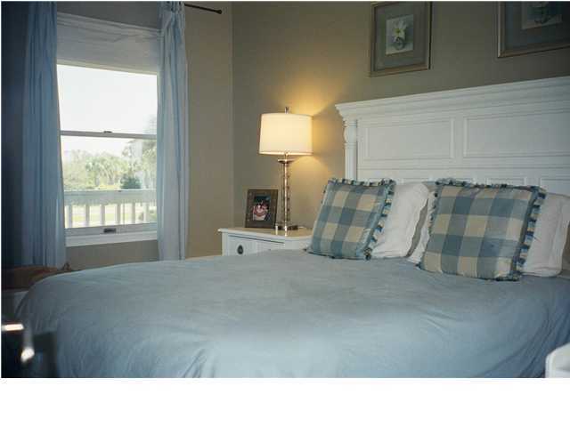 8294 Hwy Inlet Beach, Unit 7 30A Inlet Beach, FL 32461 - Photo 7 of 8 a living room with furniture and a lamp