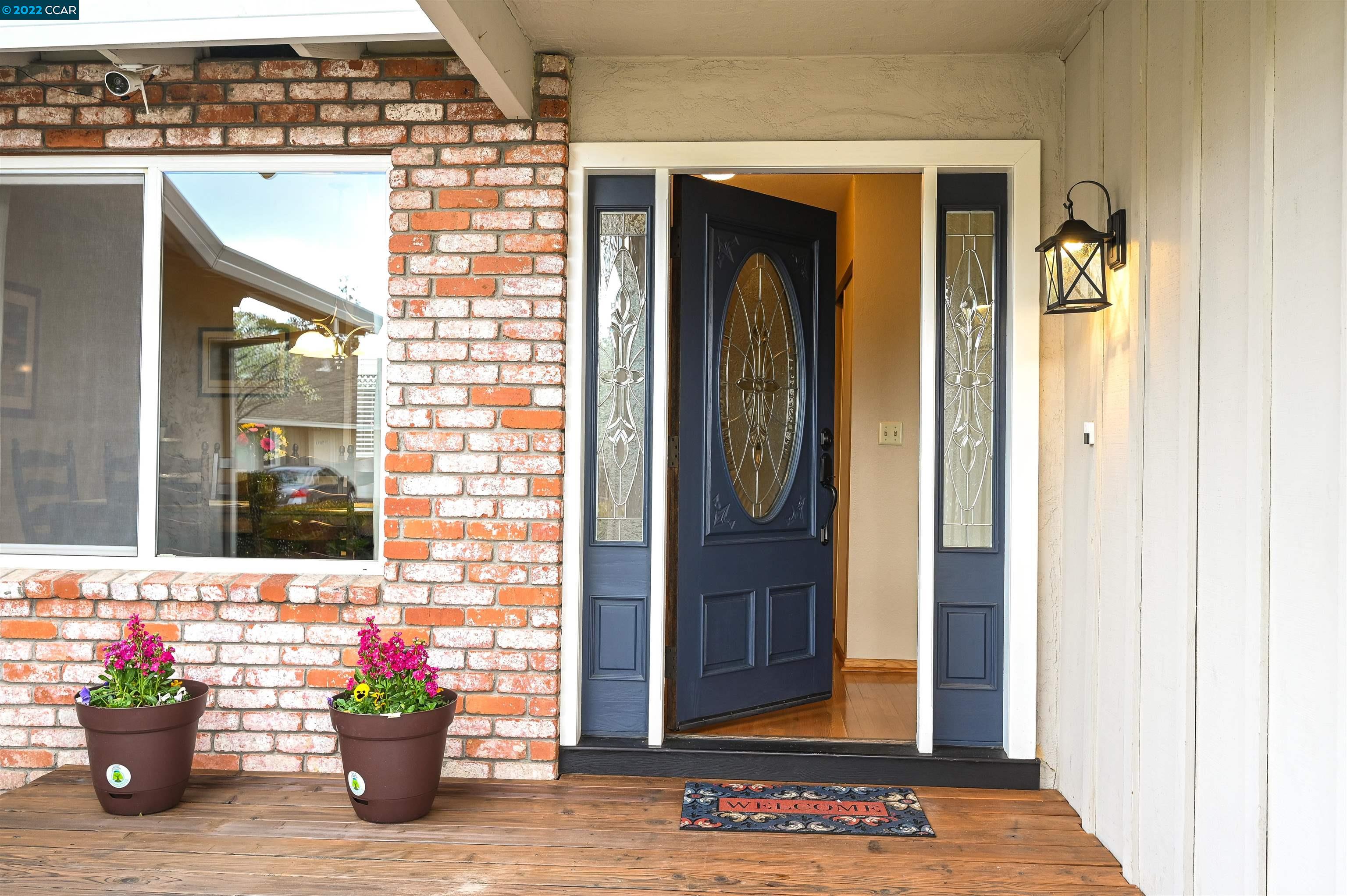 3088 Riviera Way San Ramon, CA 94583 - Photo 1 of 1 a view of a door with a potted plant on a street