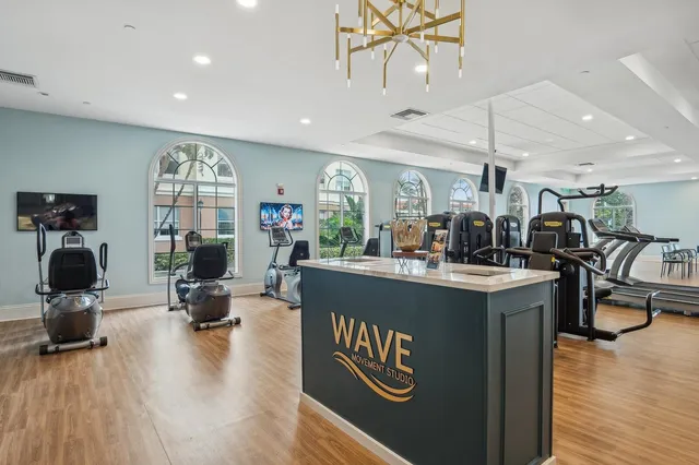 a kitchen with sink and view of living room