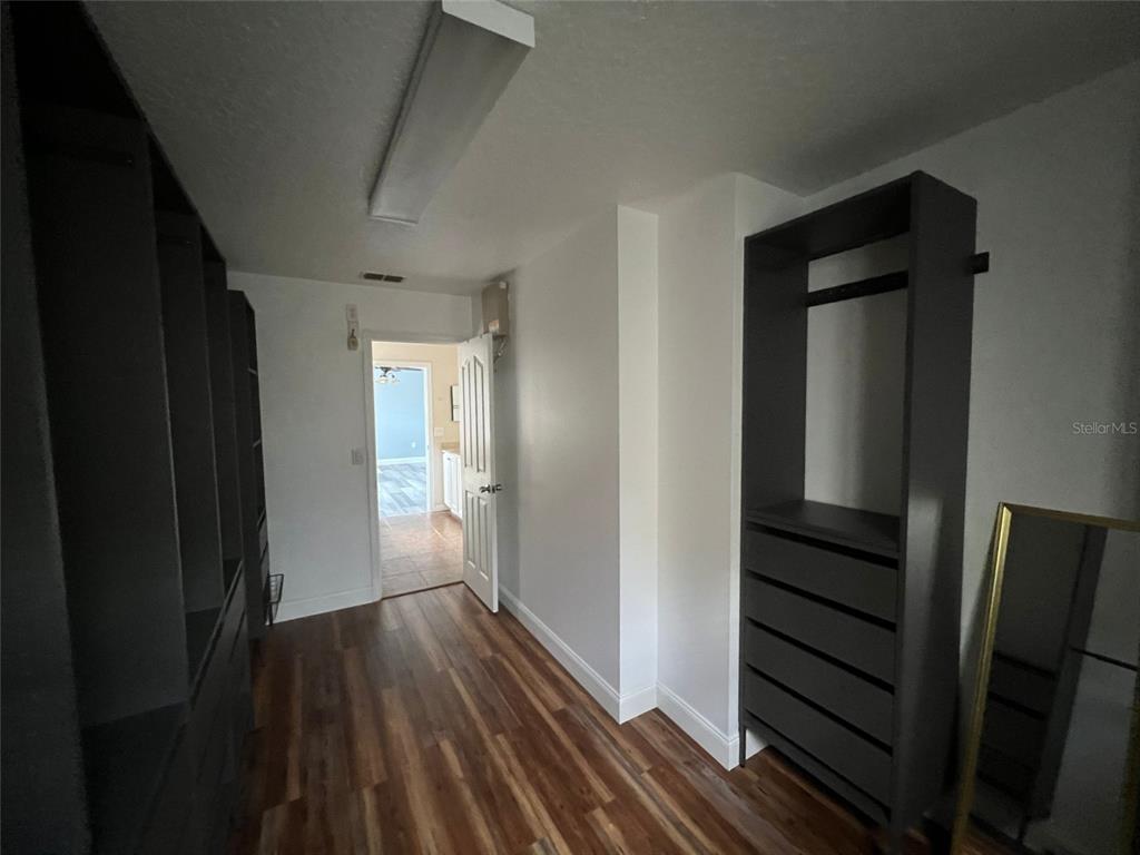 2570 Wild Tamarind Boulevard Orlando, FL 32828 - Photo 12 of 20 a view of hallway with wooden floor