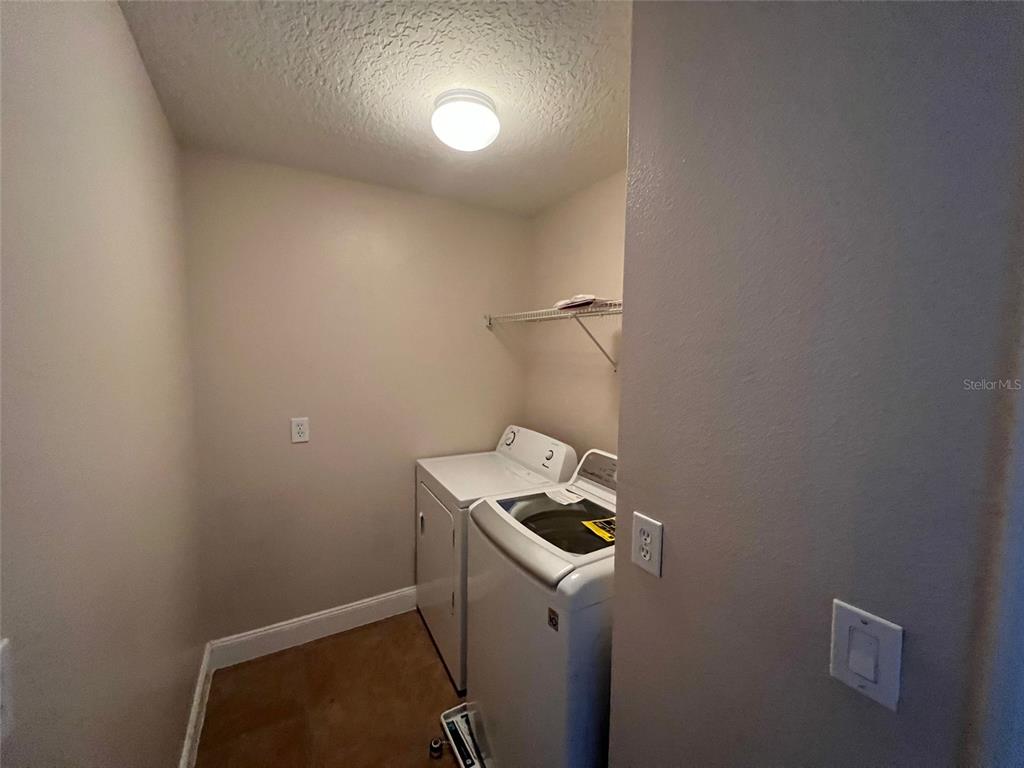 2570 Wild Tamarind Boulevard Orlando, FL 32828 - Photo 14 of 20 a room with storage and utility