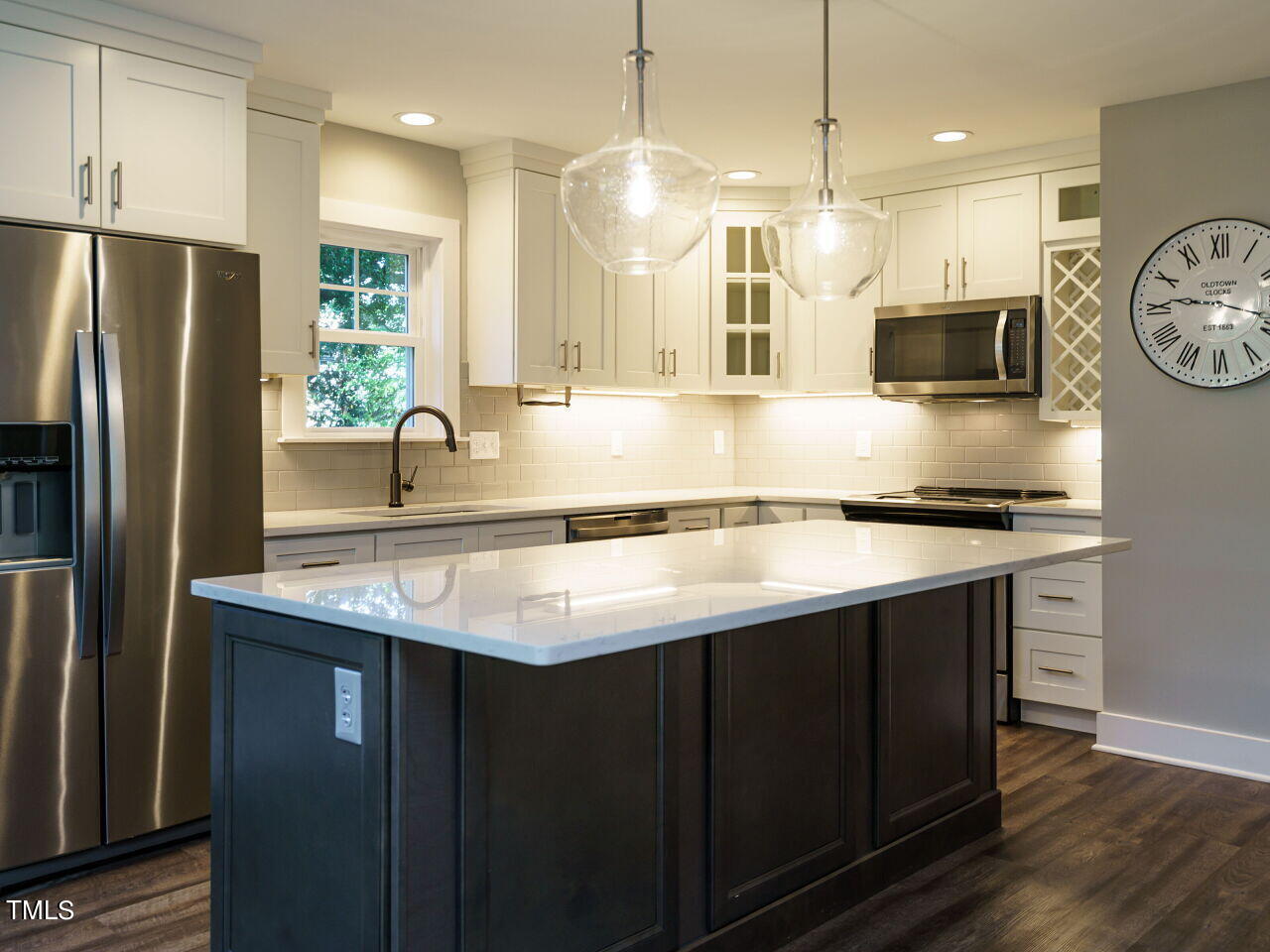 611 Frank Street Raleigh, NC 27604 - Photo 4 of 30 a kitchen with stainless steel appliances granite countertop a sink a refrigerator and a stove