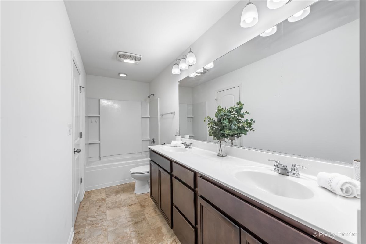 2375 Upland Road Pingree Grove, IL 60140 - Photo 13 of 32 a bathroom with a sink a toilet and shower