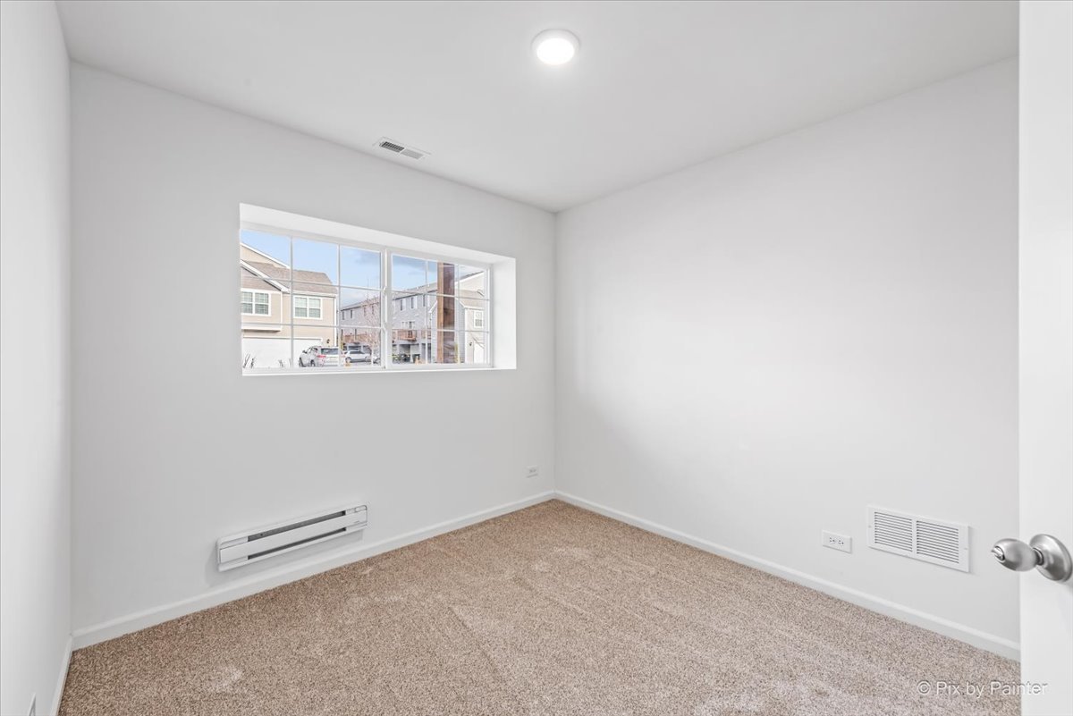 2375 Upland Road Pingree Grove, IL 60140 - Photo 17 of 32 an empty room with a window