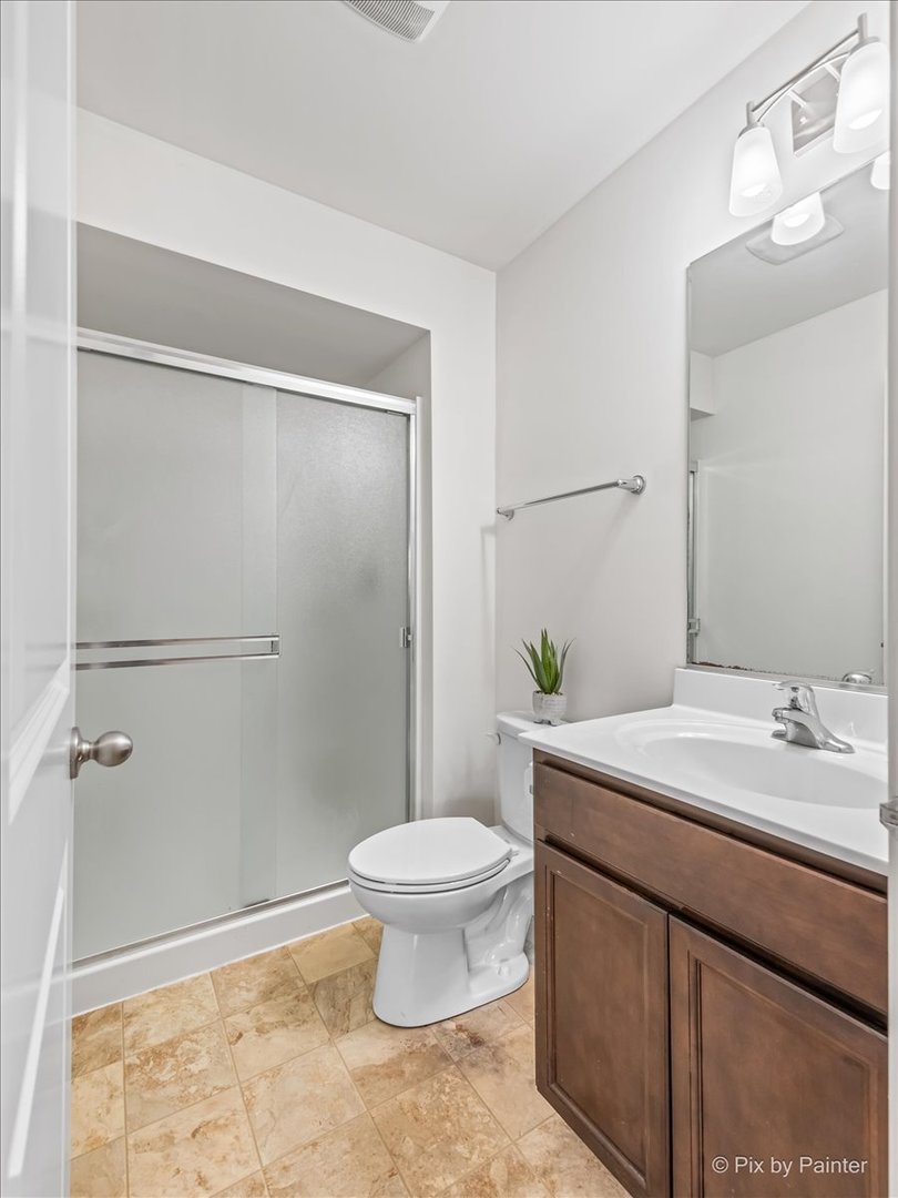 2375 Upland Road Pingree Grove, IL 60140 - Photo 19 of 32 a bathroom with a sink toilet and shower