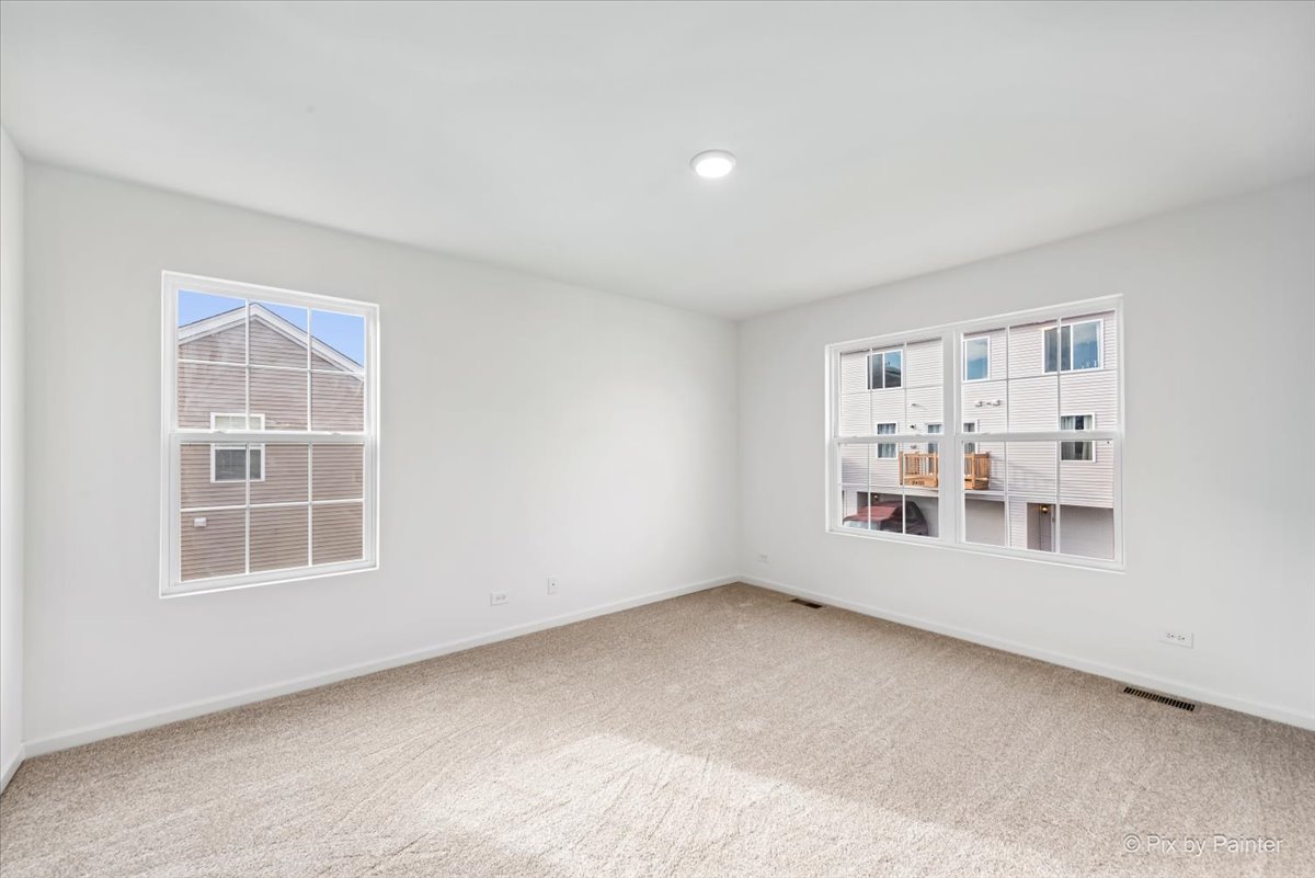 2375 Upland Road Pingree Grove, IL 60140 - Photo 5 of 32 an empty room with a window