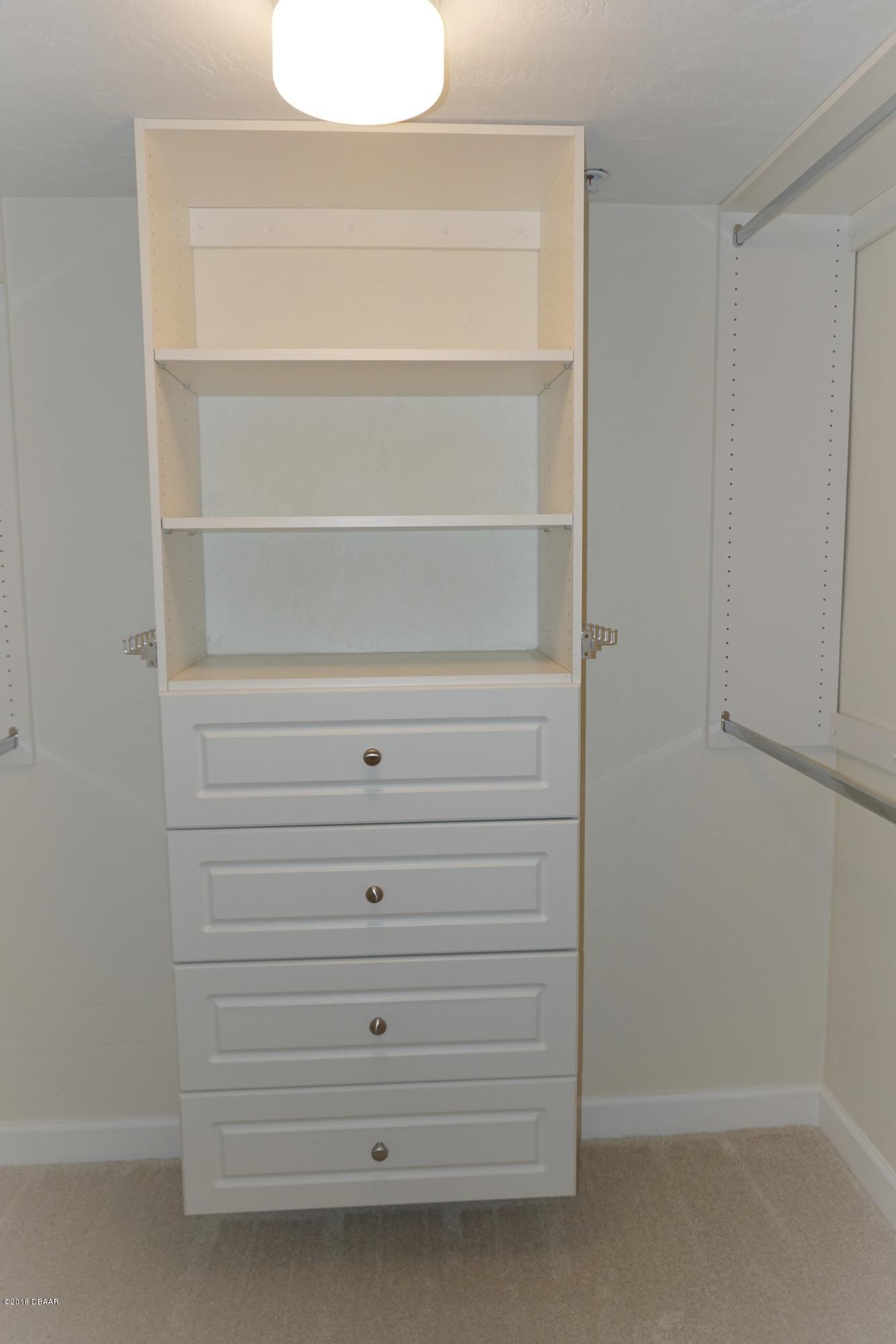 1 John Anderson Drive, Unit 113 Ormond Beach, FL 32176 - Photo 27 of 76 a close up view of a closet