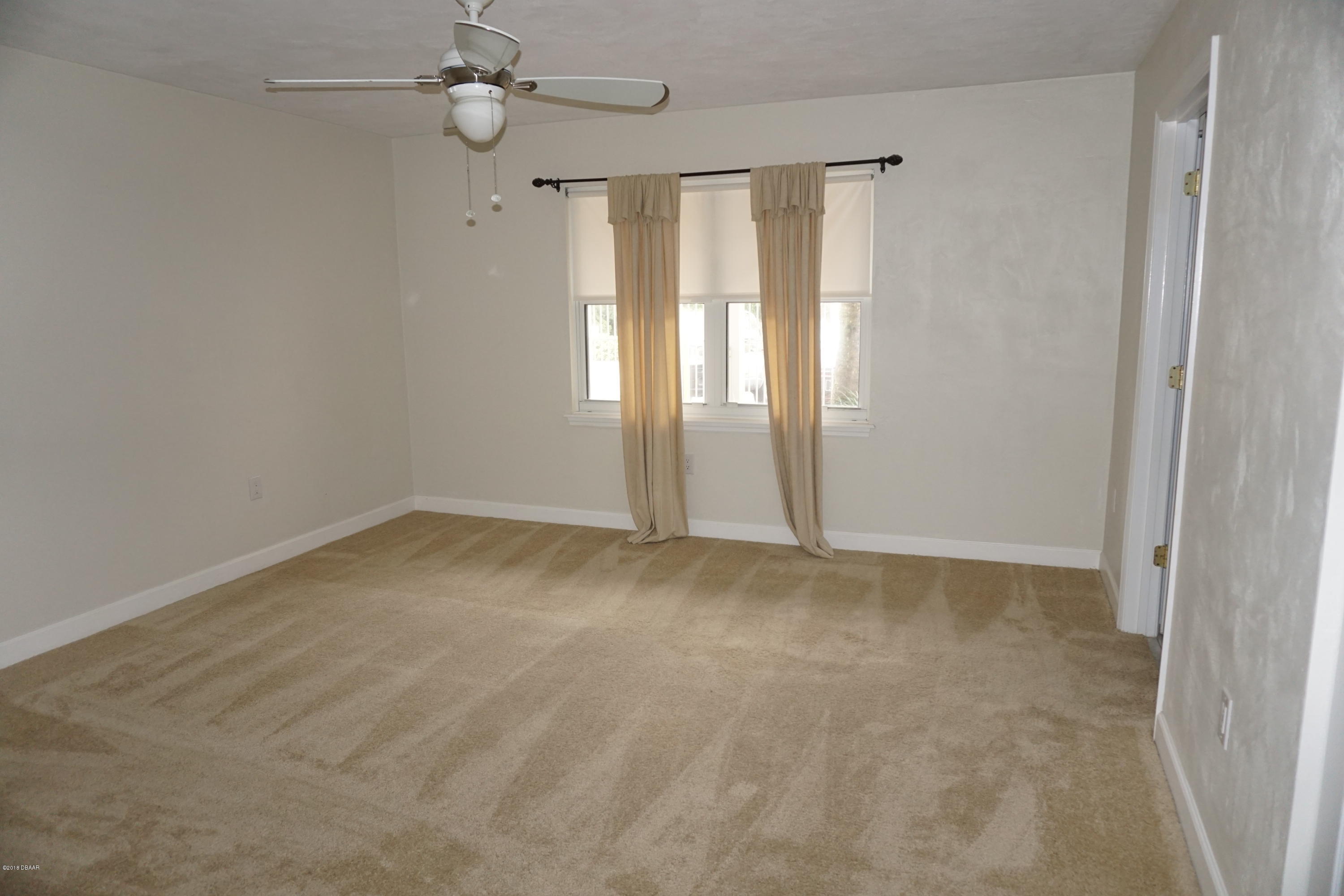 1 John Anderson Drive, Unit 113 Ormond Beach, FL 32176 - Photo 29 of 76 an empty room with a window