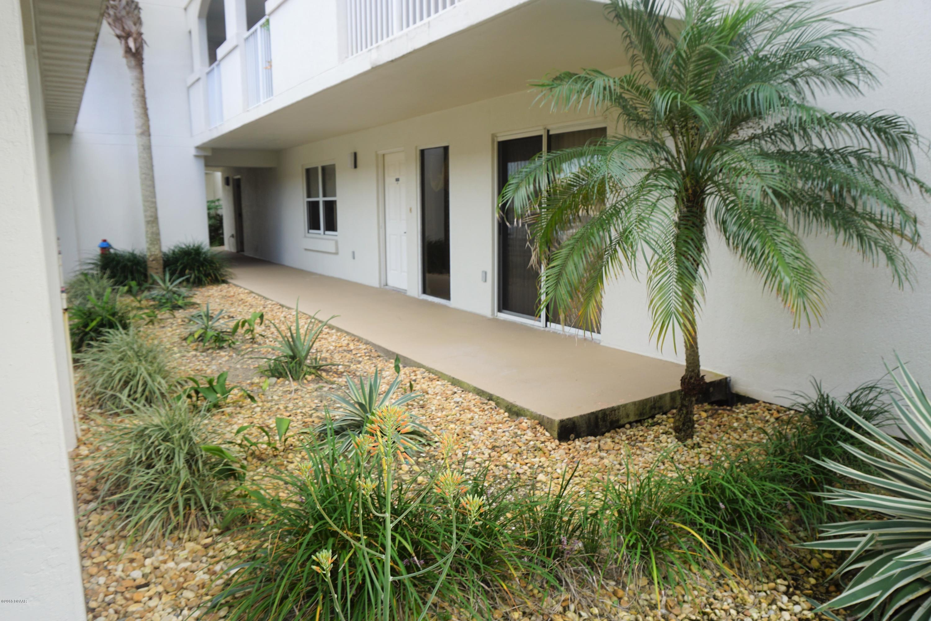 1 John Anderson Drive, Unit 113 Ormond Beach, FL 32176 - Photo 3 of 76 a view of a backyard