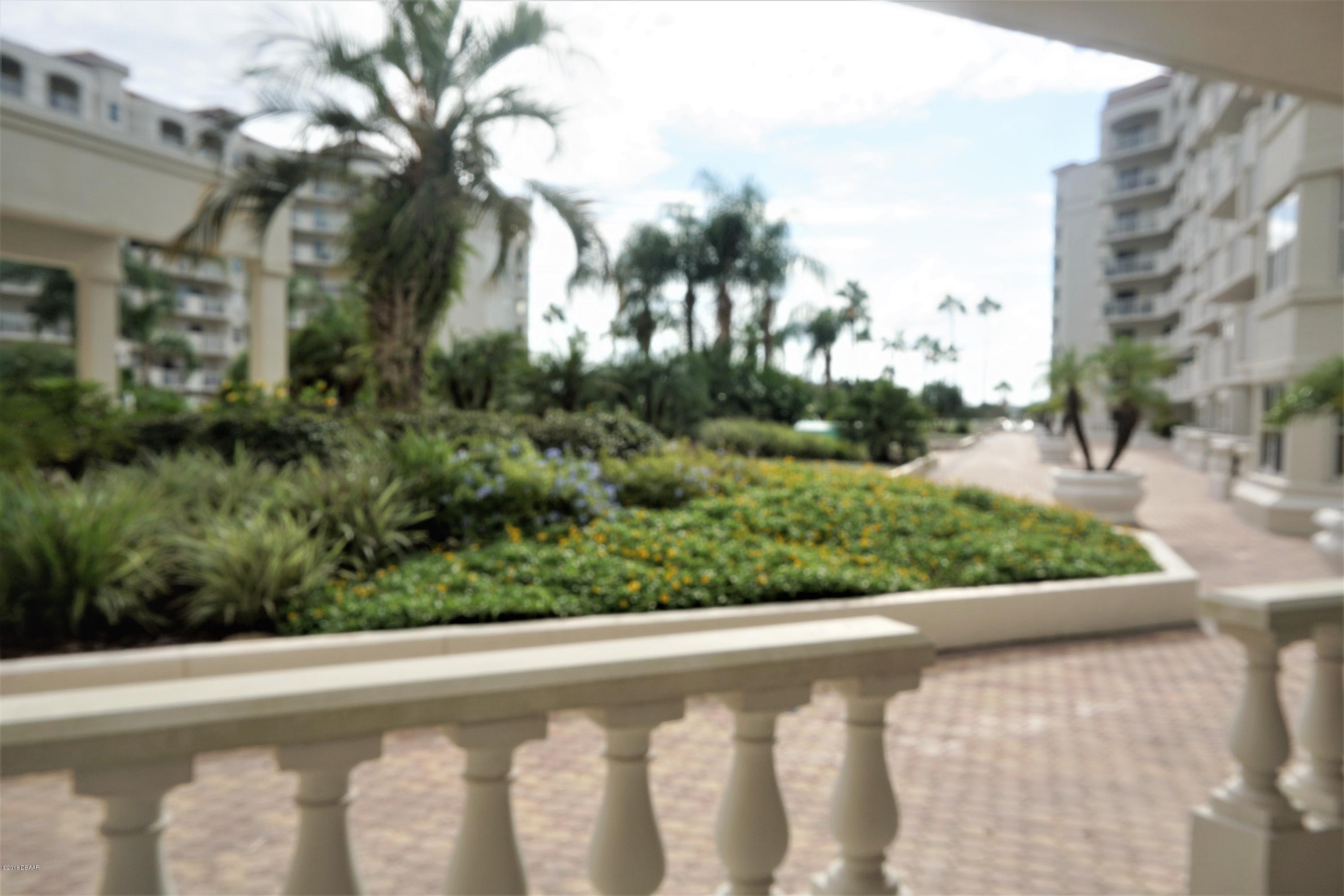 1 John Anderson Drive, Unit 113 Ormond Beach, FL 32176 - Photo 39 of 76 a view of a yard and a street view