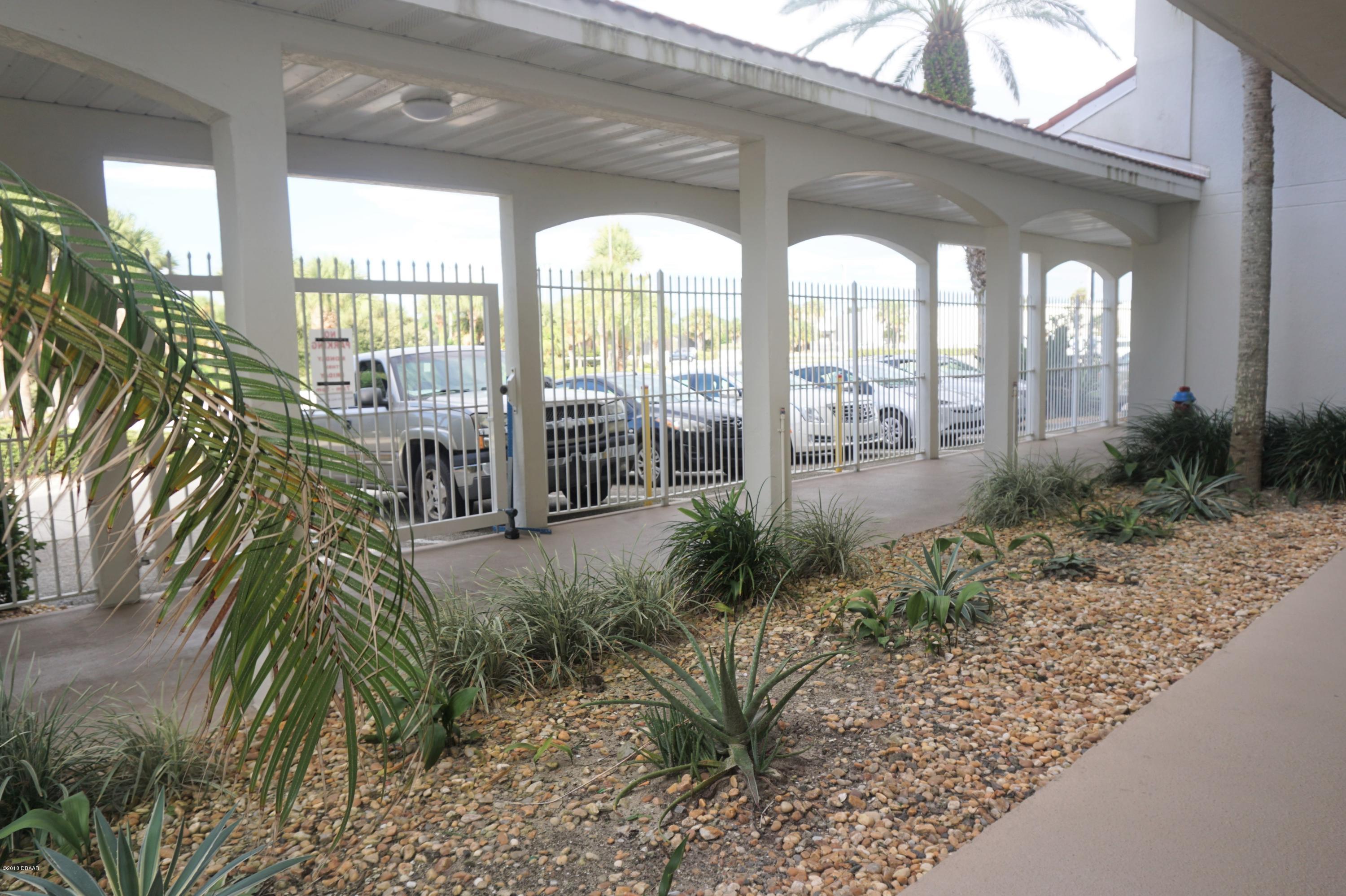1 John Anderson Drive, Unit 113 Ormond Beach, FL 32176 - Photo 41 of 76 Parking outside door