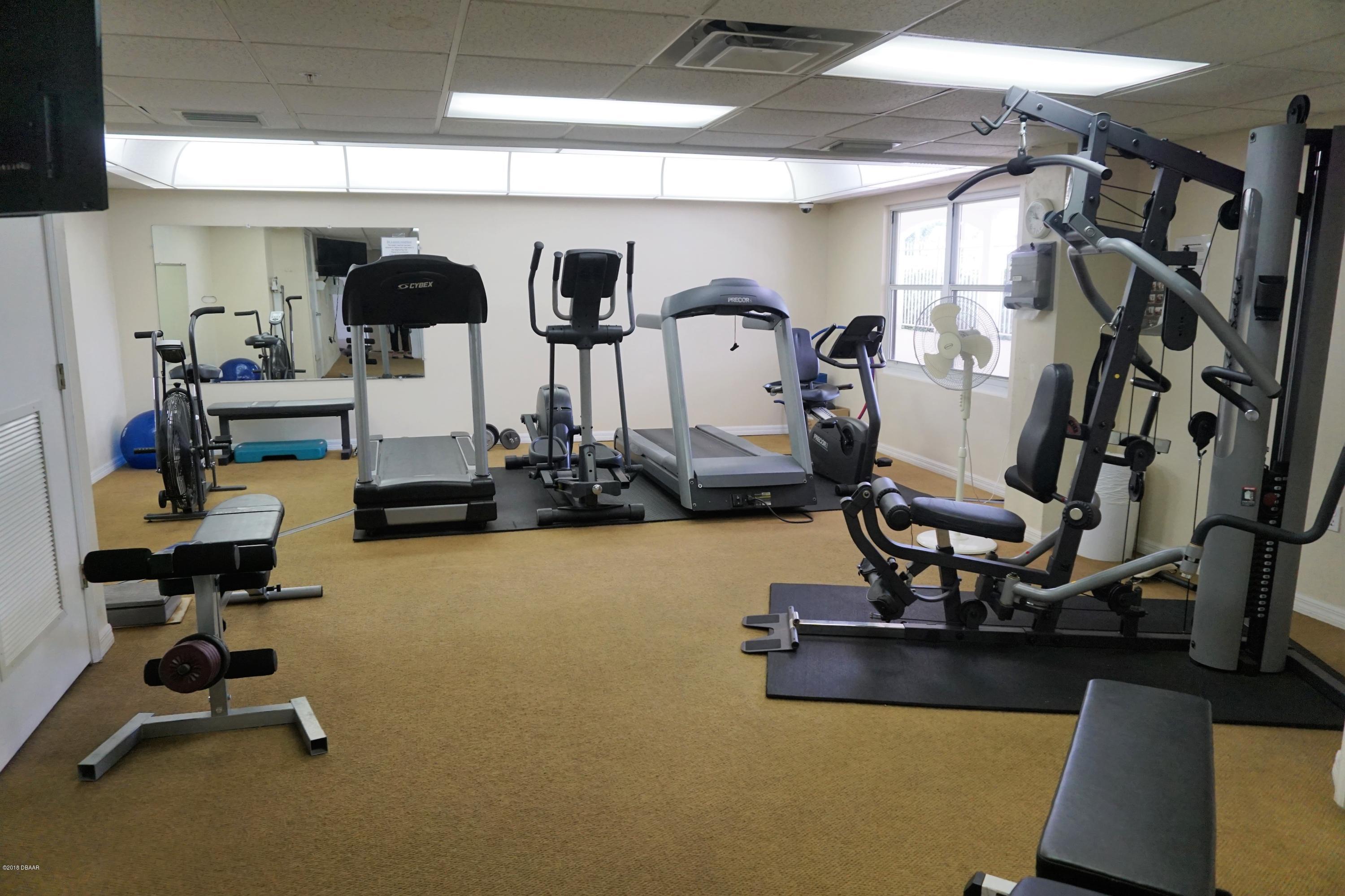 1 John Anderson Drive, Unit 113 Ormond Beach, FL 32176 - Photo 42 of 76 a view of a room with gym equipment