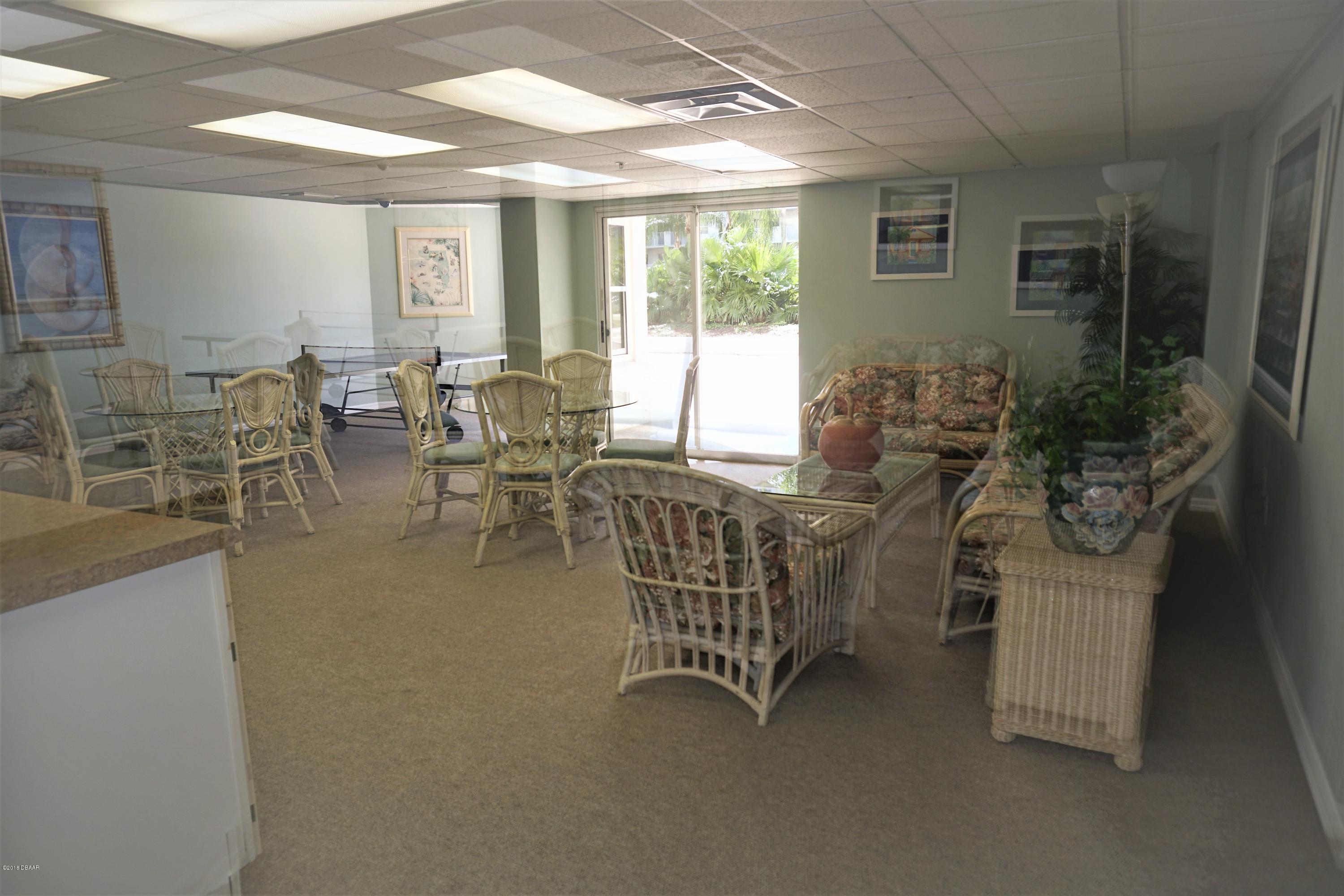 1 John Anderson Drive, Unit 113 Ormond Beach, FL 32176 - Photo 46 of 76 a dining room with furniture and windows