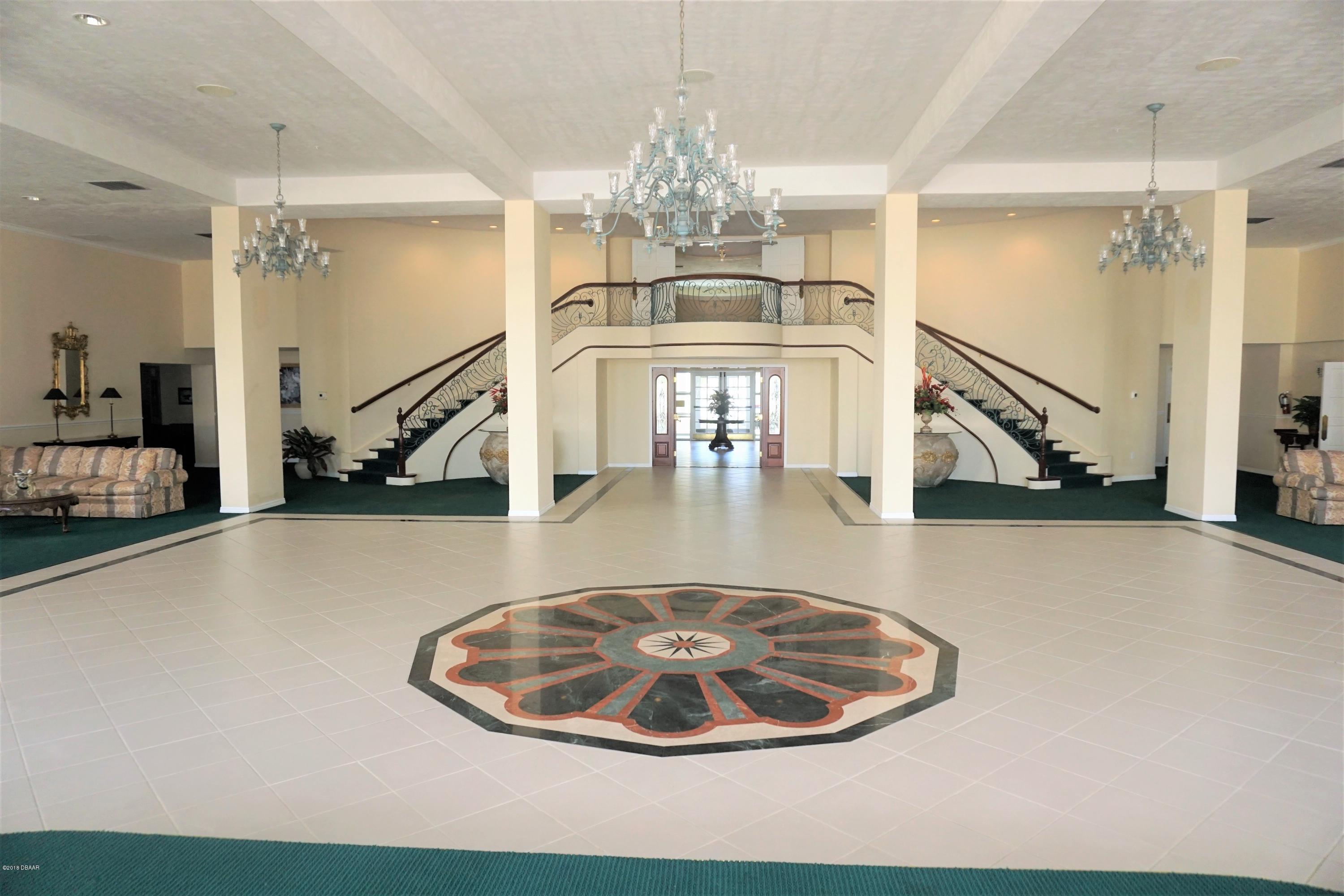 1 John Anderson Drive, Unit 113 Ormond Beach, FL 32176 - Photo 52 of 76 Ballroom toward lobby