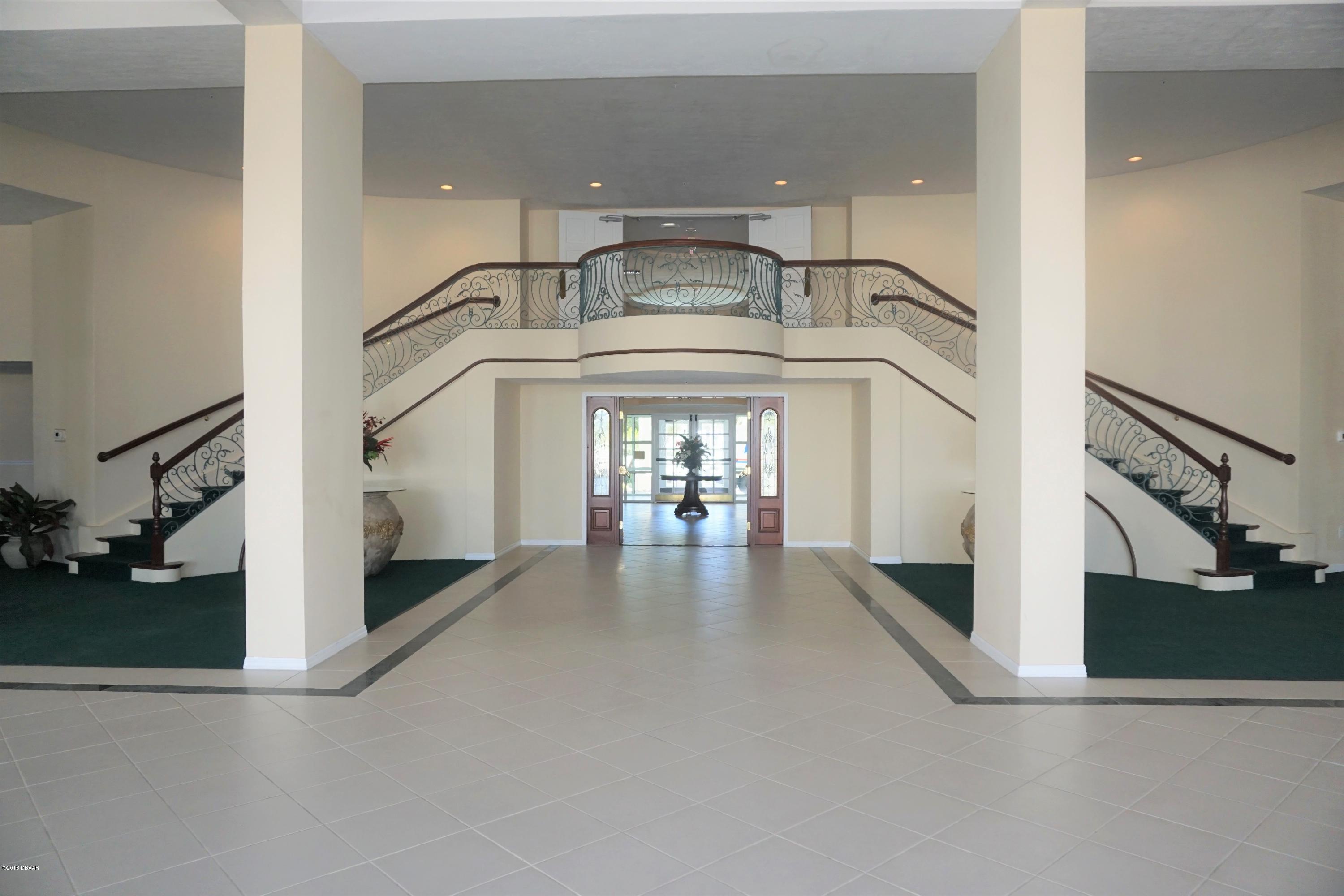 1 John Anderson Drive, Unit 113 Ormond Beach, FL 32176 - Photo 53 of 76 Ballroom w/ stairway