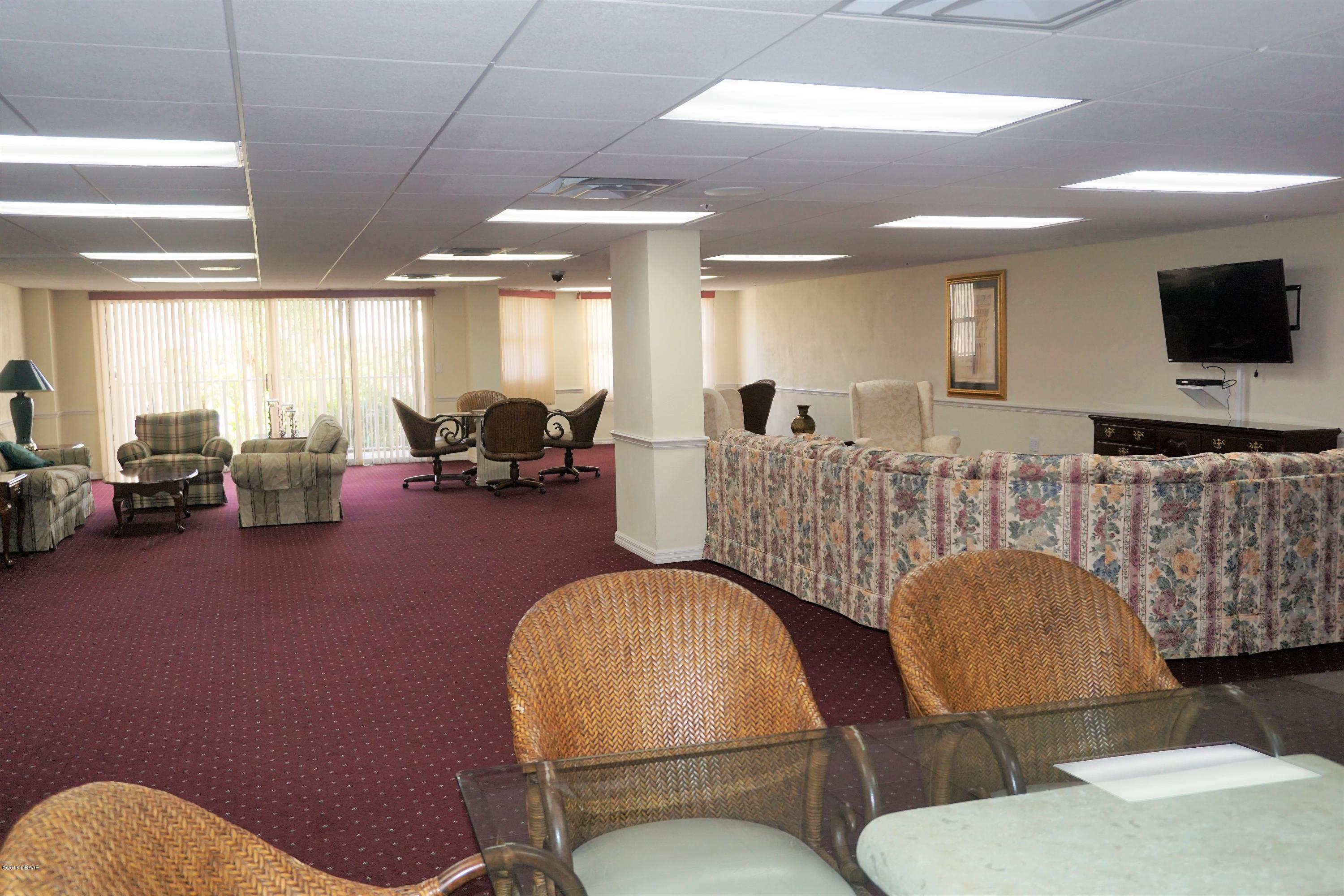 1 John Anderson Drive, Unit 113 Ormond Beach, FL 32176 - Photo 55 of 76 a living room with furniture kitchen view and a window