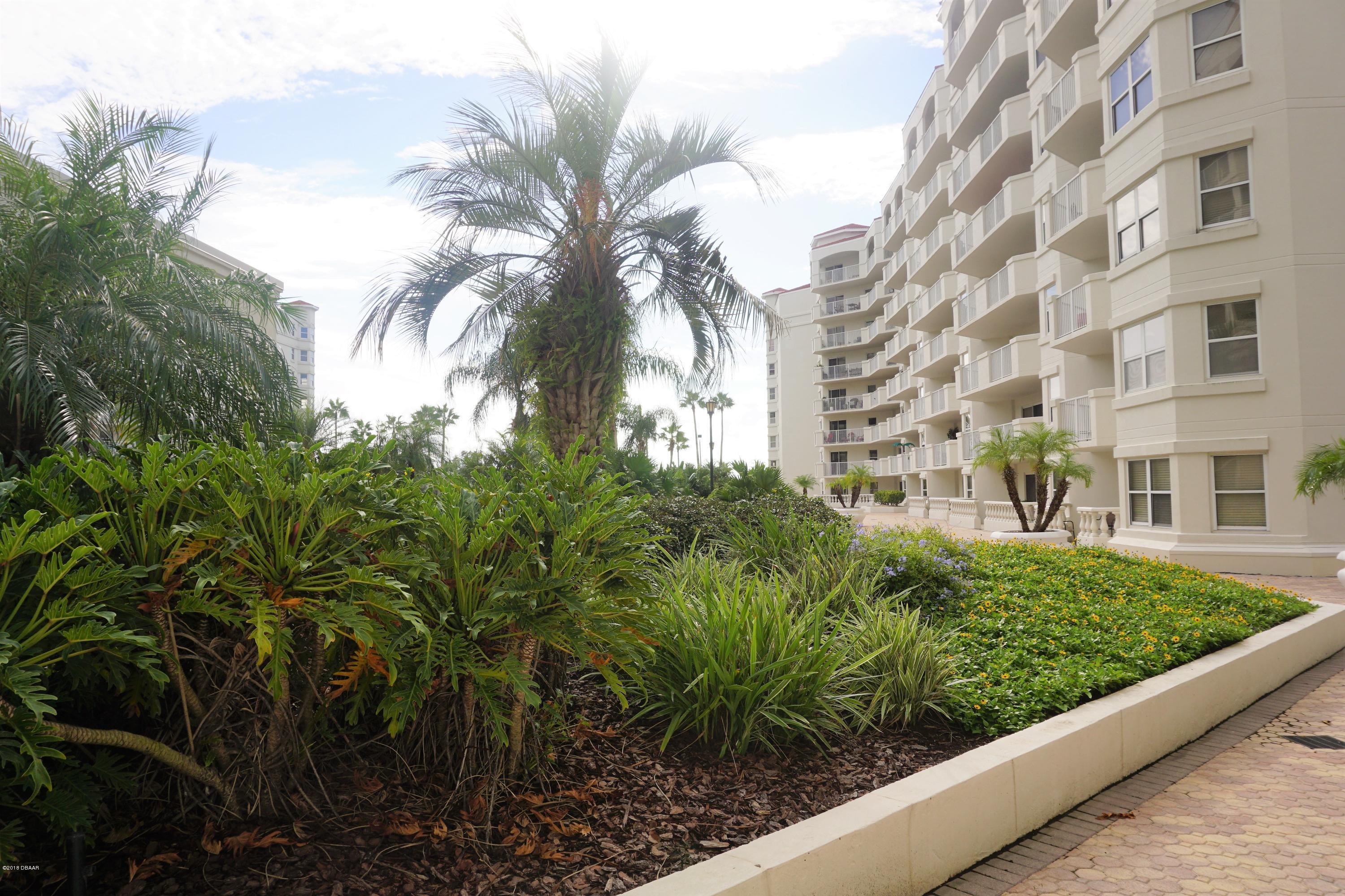 1 John Anderson Drive, Unit 113 Ormond Beach, FL 32176 - Photo 6 of 76 a view of a multi story yard